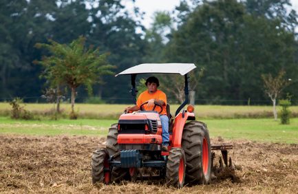Alabama FFA student on tractor