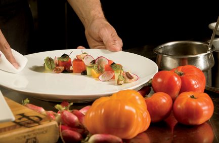 A salad of local mixed greens and fruit served at the Coach House