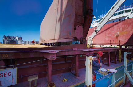 A longshoreman levels a load of durum wheat being exported to Italy from the Twin Ports.