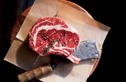 Bone In Rib Eye row Steak and knife