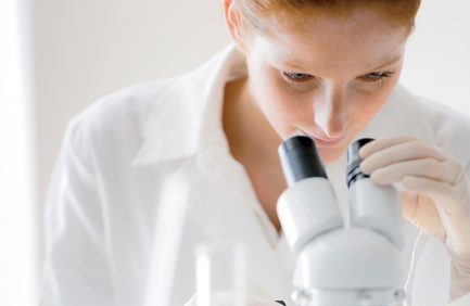 Microscope laboratory - woman medical research