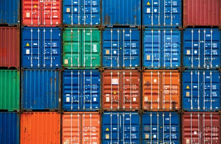 Four vertical rows of shipping containers