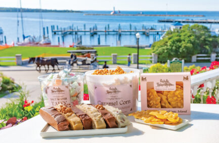Ryba's Fudge Shops products with a horse carriage in the background