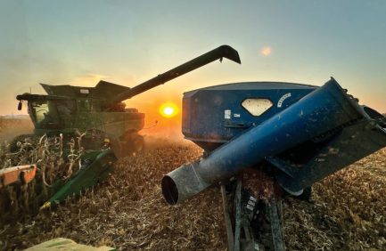 Tom Farms tractor at sunset