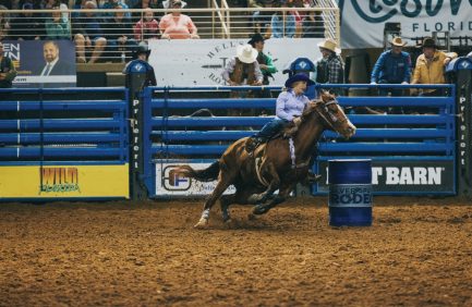 A rider and horse barrel racing at the Silver Spurs Rodeo