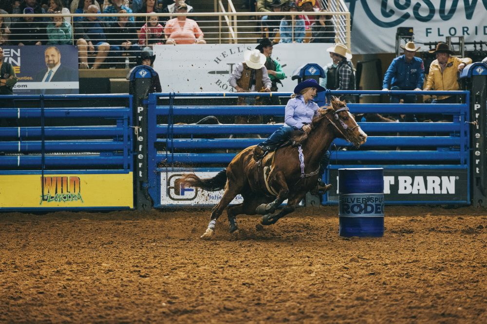 A rider and horse barrel racing at the Silver Spurs Rodeo