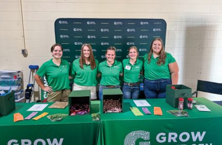 Lena Dickerson, Kaylynn Wilhelm and fellow GrowNextGen ambassadors educate youth about soybeans.