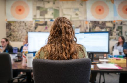 Person working on a computer in response to the HPAI outbreak in Michigan