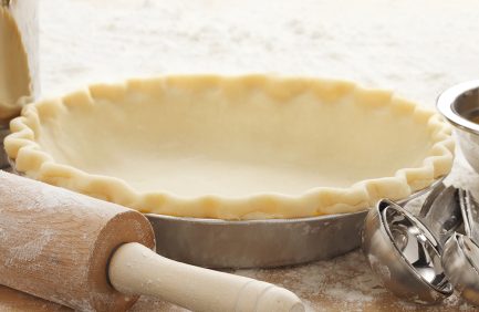 empty pie crust with rolling pin